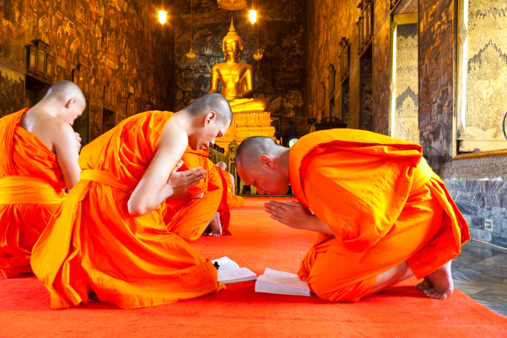 Monks during prayer at Wat Suthat Thepphawararam a royal temple of the first grade, one of ten such temples in Bangkok.
