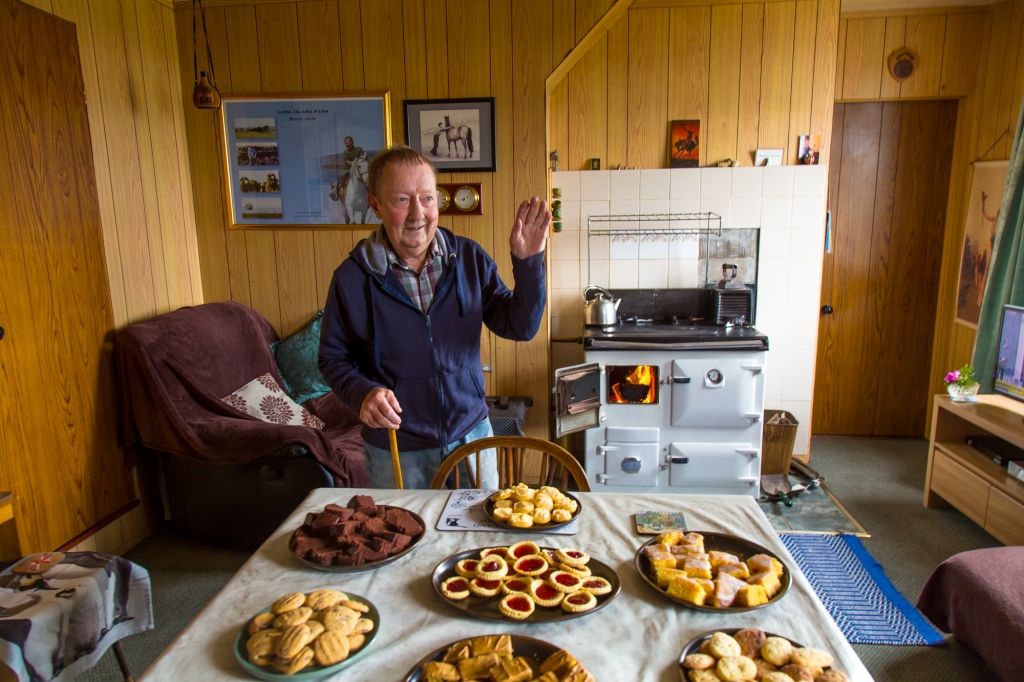 Tea and cakes served by the peat burning oven, Long Island Farm, Falkland Islands